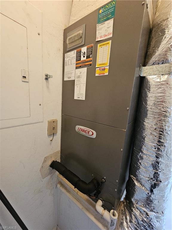 7766 Emerald Circle, Unit R201 Naples, FL 34109 - Photo 33 of 35 a view of water heater room