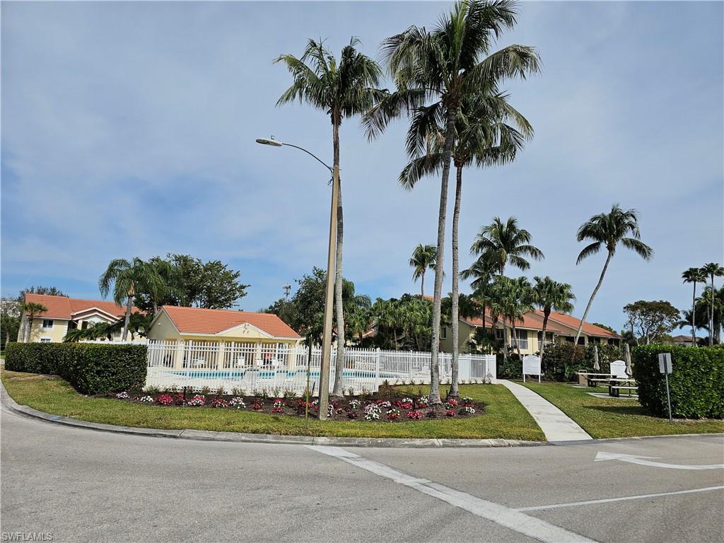 7766 Emerald Circle, Unit R201 Naples, FL 34109 - Photo 35 of 35 a view of a city with palm trees