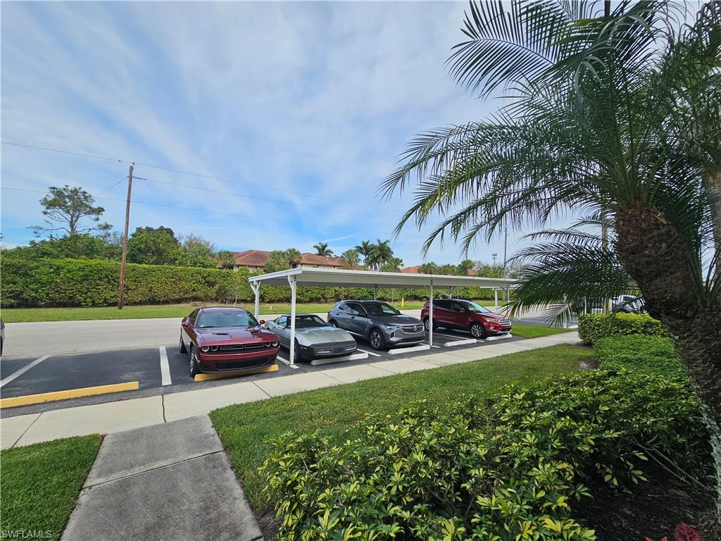 7766 Emerald Circle, Unit R201 Naples, FL 34109 - Photo 6 of 35 a view of outdoor space yard and patio