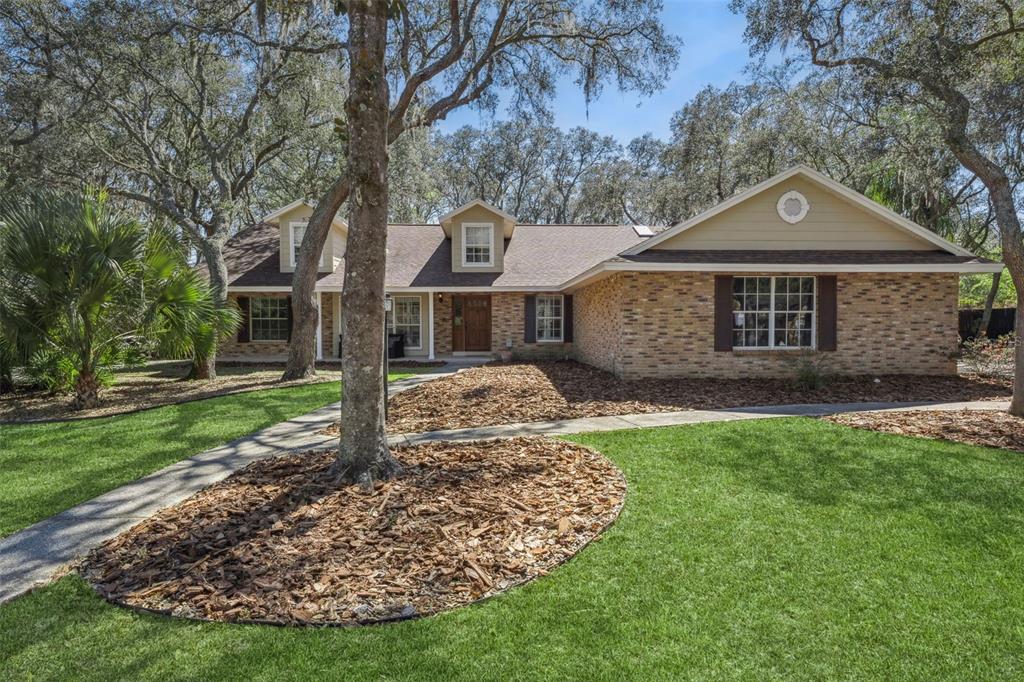 1105 Northern Way Winter Springs, FL 32708 - Photo 1 of 1 a front view of a house with garden