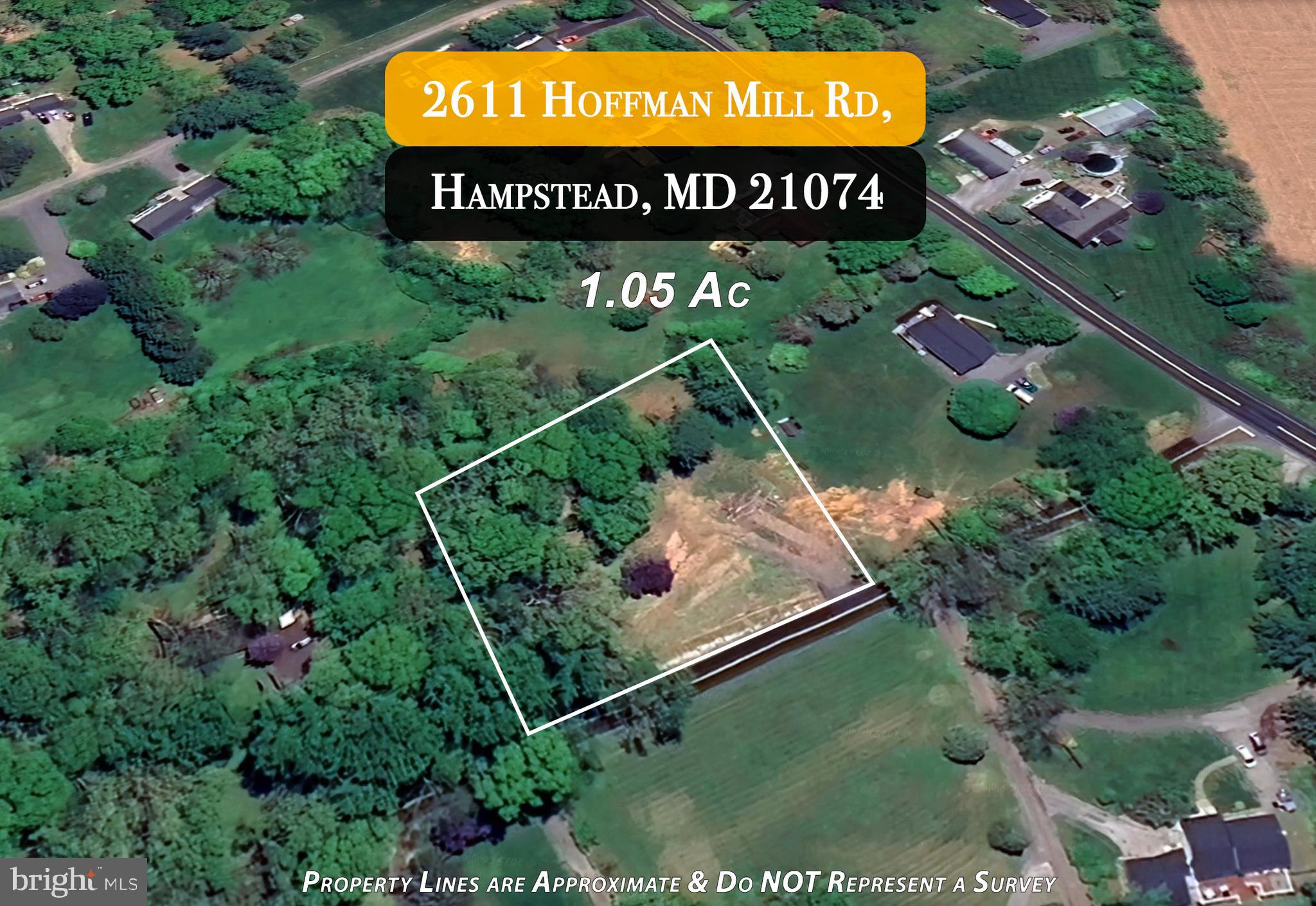 2611 Hoffman Mill Road Hampstead, MD 21074 - Photo 2 of 5 a sign that is sitting on a field