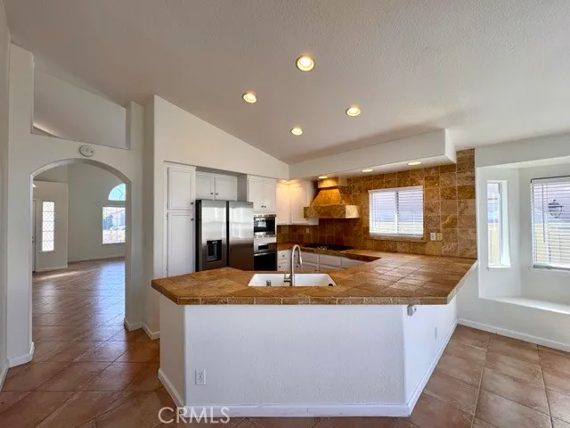 a view of kitchen dining table with cabinets