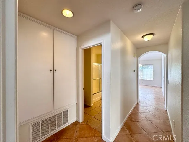 a view of an empty room with a bathroom
