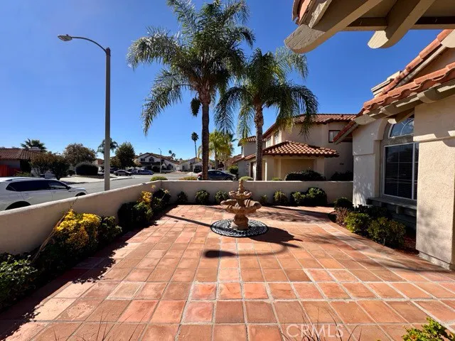 a view of a patio with swimming pool table and chairs