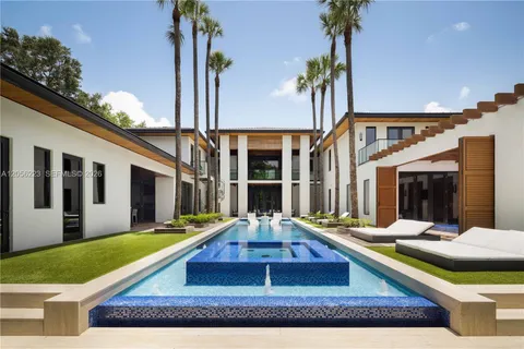 a view of swimming pool with a patio