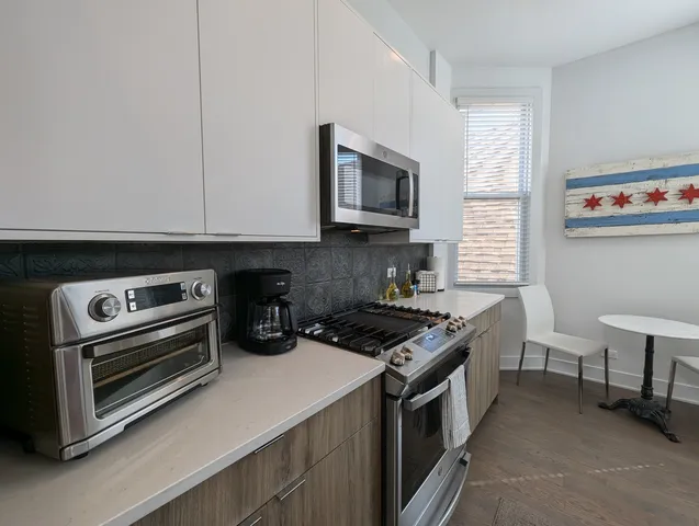 a kitchen with a stove and a microwave