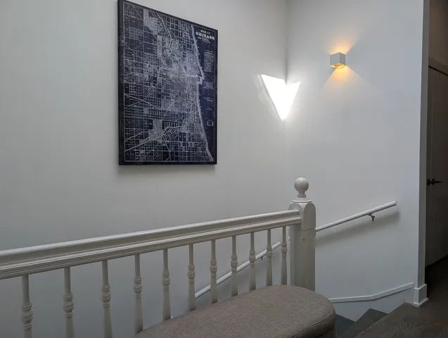 a view of entryway with a window and wooden floor