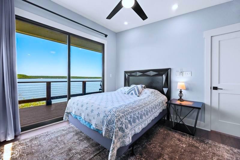 8301 County Road 300 Graham, TX 76450 - Photo 11 of 40 a bedroom with a bed and large window