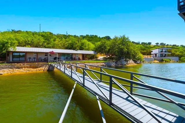 a view of a table and chairs on the roof deck