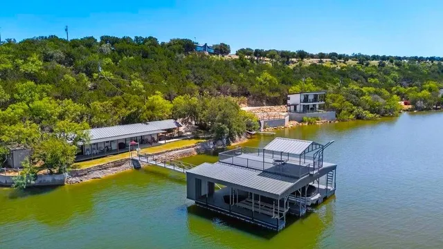 an aerial view of a house with a ocean view