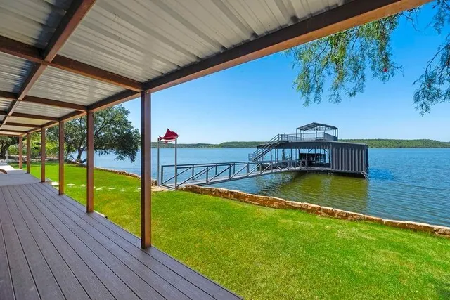 a view of a swimming pool with a patio