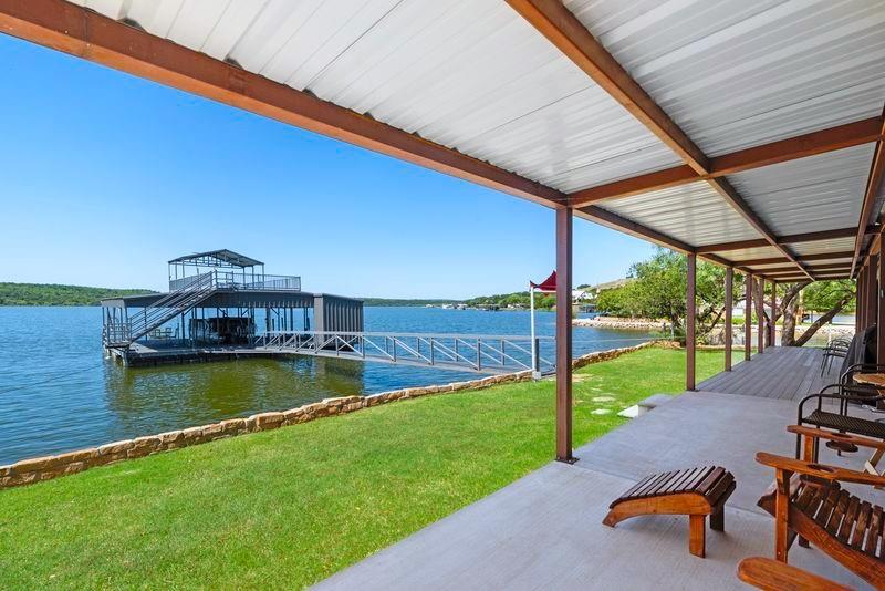 8301 County Road 300 Graham, TX 76450 - Photo 24 of 40 a view of a swimming pool with a patio
