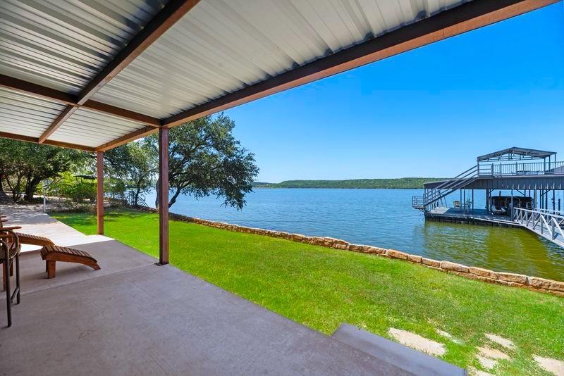 8301 County Road 300 Graham, TX 76450 - Photo 25 of 40 a view of a swimming pool with a patio