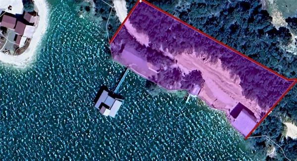 a small pool is sitting in the middle of a lake