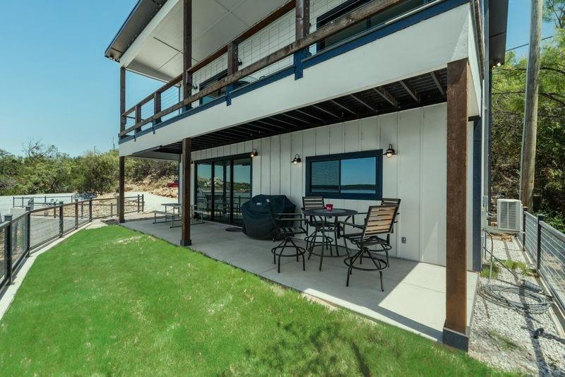 8301 County Road 300 Graham, TX 76450 - Photo 35 of 40 a view of a porch with chairs and backyard