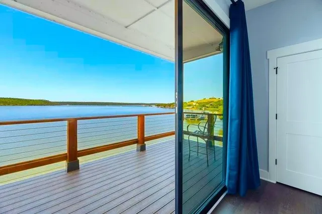 a view of a balcony with chairs