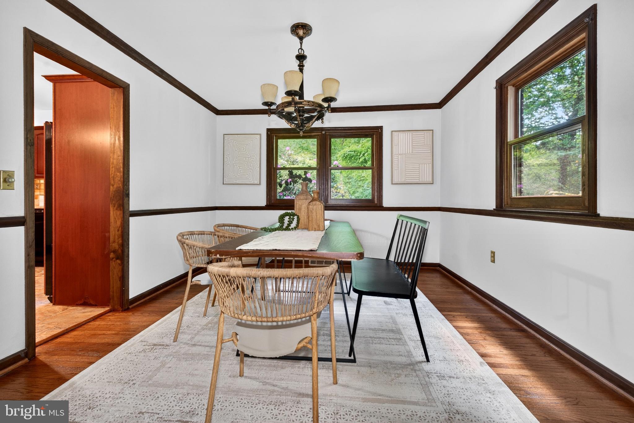 17201 Whiteley Road Monkton, MD 21111 - Photo 12 of 47 a dining room with furniture a chandelier and wooden floor