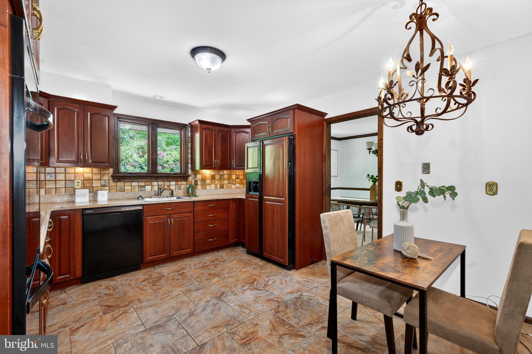 17201 Whiteley Road Monkton, MD 21111 - Photo 14 of 47 a kitchen with a refrigerator and a sink