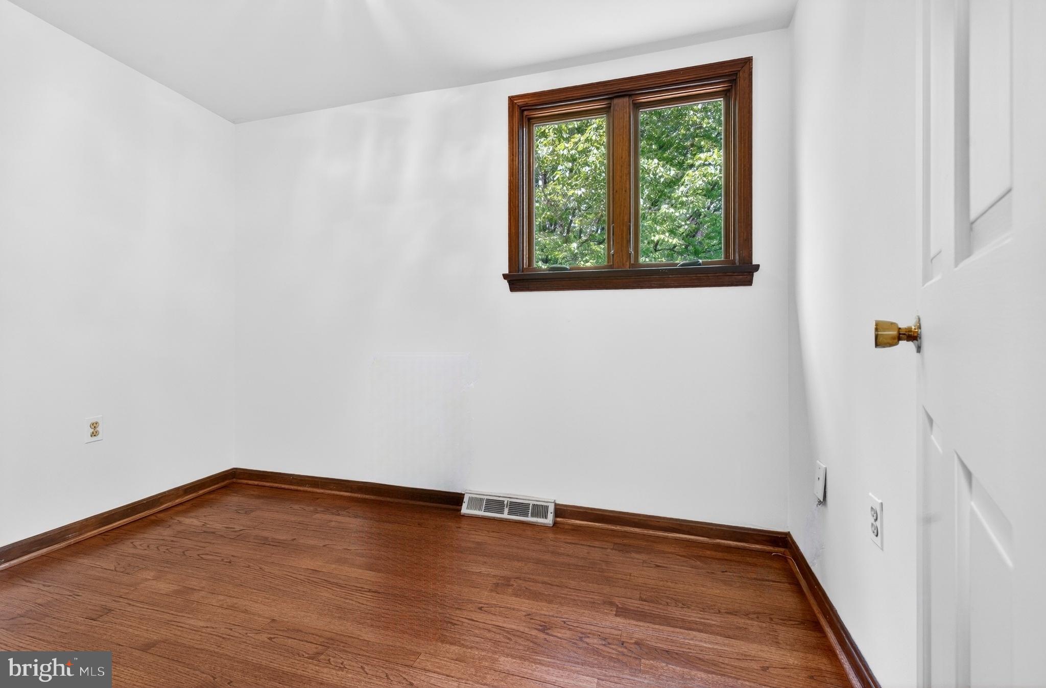 17201 Whiteley Road Monkton, MD 21111 - Photo 28 of 47 a view of an empty room with wooden floor and a window