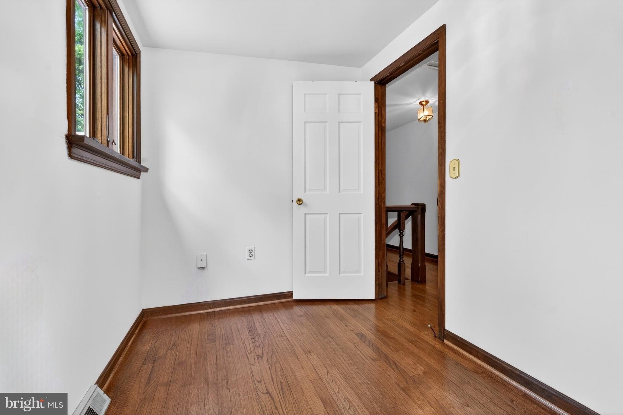 17201 Whiteley Road Monkton, MD 21111 - Photo 29 of 47 an empty room with wooden floor and windows
