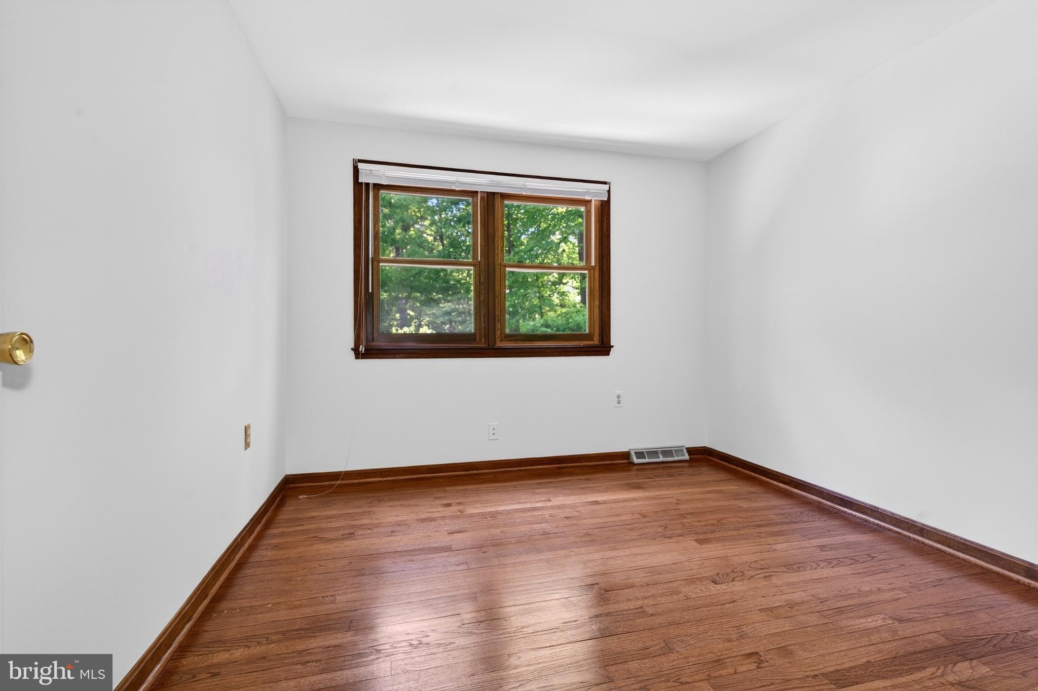 17201 Whiteley Road Monkton, MD 21111 - Photo 30 of 47 an empty room with wooden floor and windows