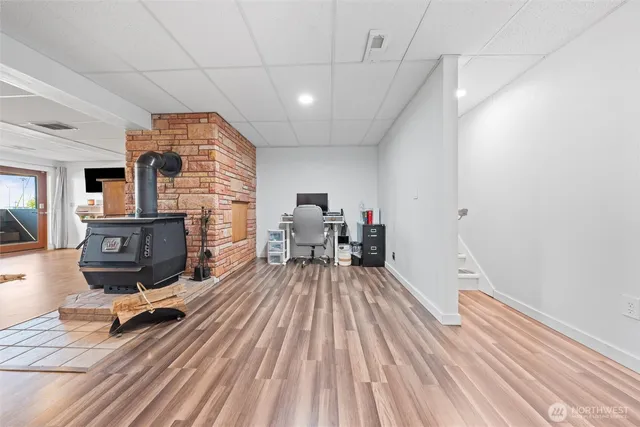 a bedroom with furniture and a wooden floor