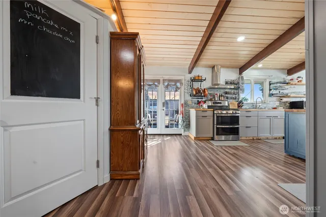 a kitchen with stainless steel appliances granite countertop a stove and a refrigerator