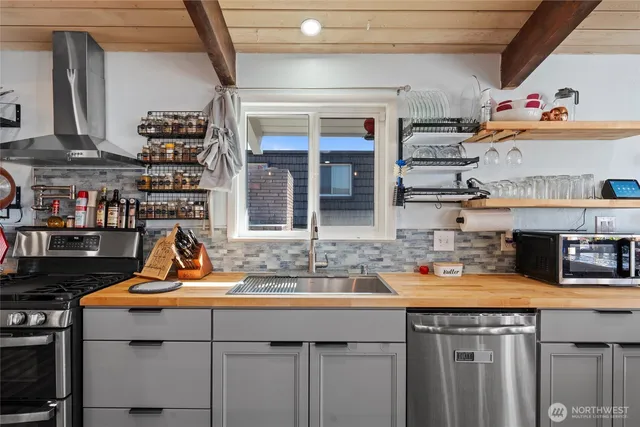 a kitchen with a sink and cabinets