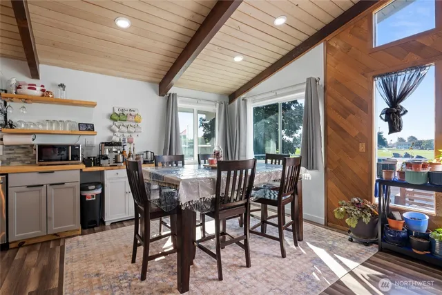 a view of a dining room with furniture window and outside view