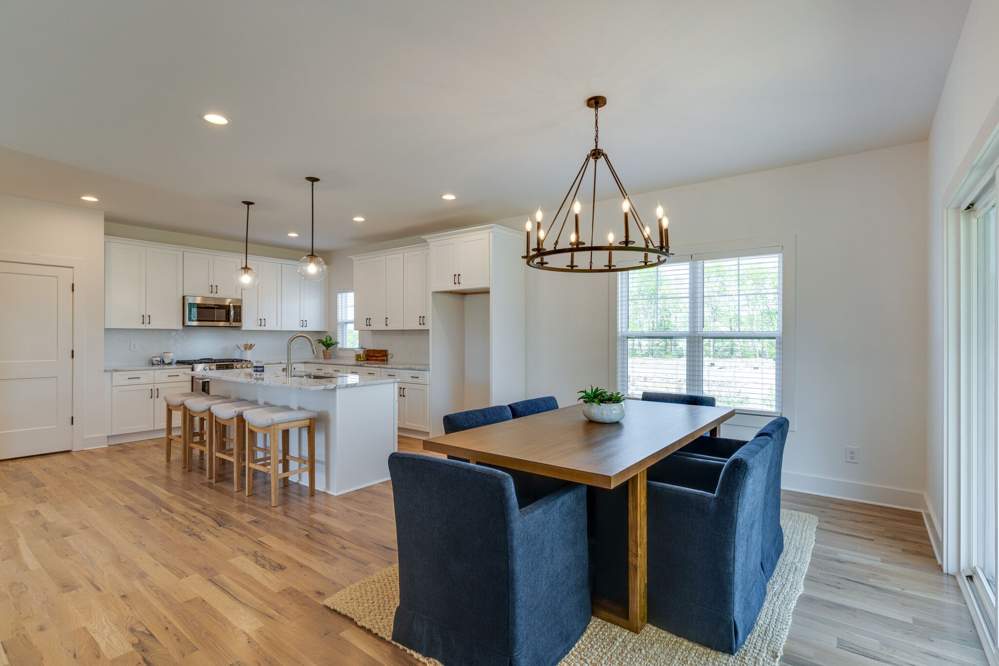 1205 Apache Lane Madison, TN 37115 - Photo 8 of 34 a kitchen with a table chairs and wooden floor