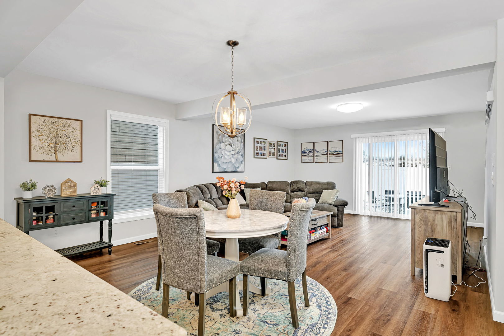 1872 Red Willow Road Morris, IL 60450 - Photo 6 of 22 a view of a dining room and livingroom with furniture wooden floor a chandelier