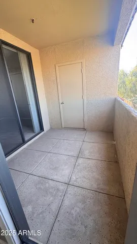 a view of a balcony with an outdoor space