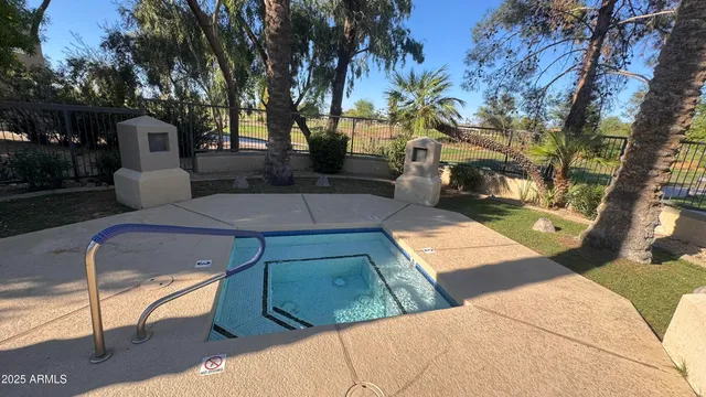 a view of a patio with couches and a fire pit