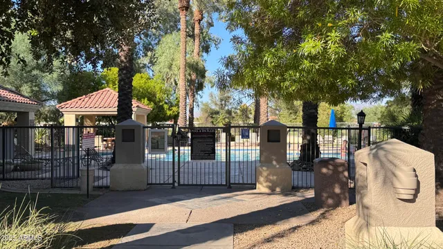 a view of a house with wooden fence