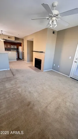 a view of an empty room with a fireplace