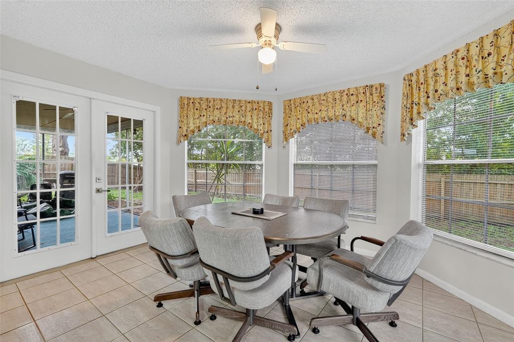 3602 Player Drive New Port Richey, FL 34655 - Photo 13 of 42 a dining room with furniture and window