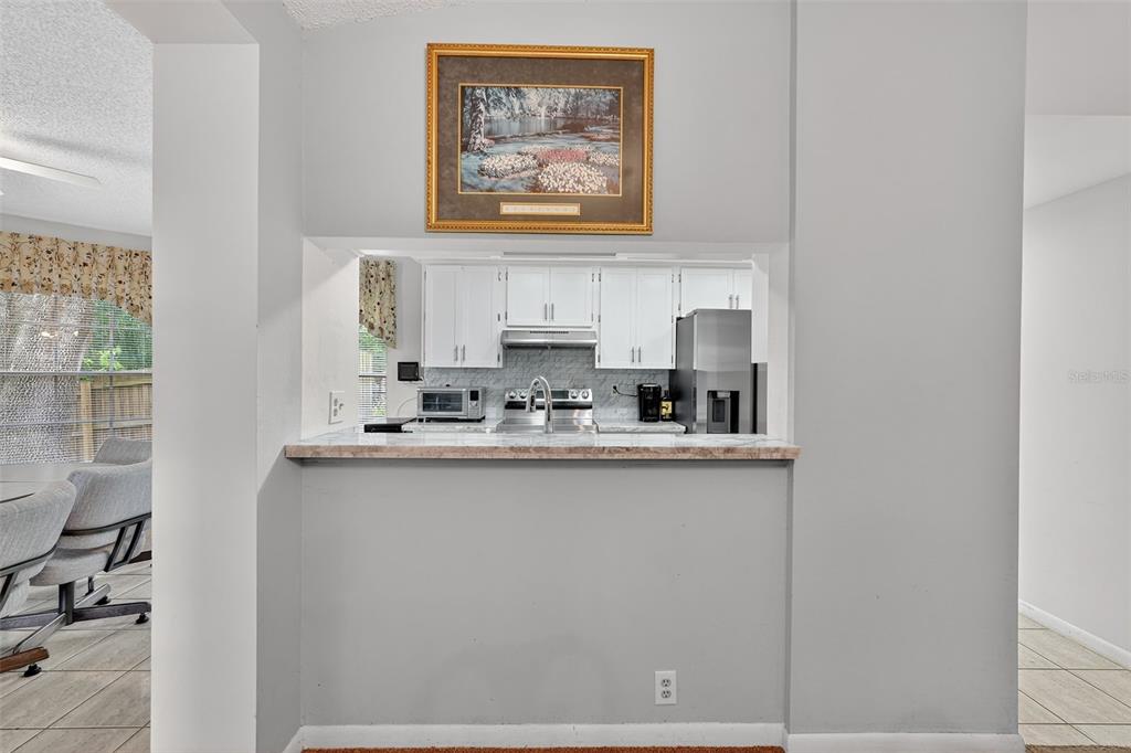3602 Player Drive New Port Richey, FL 34655 - Photo 16 of 42 a kitchen with a sink and cabinets