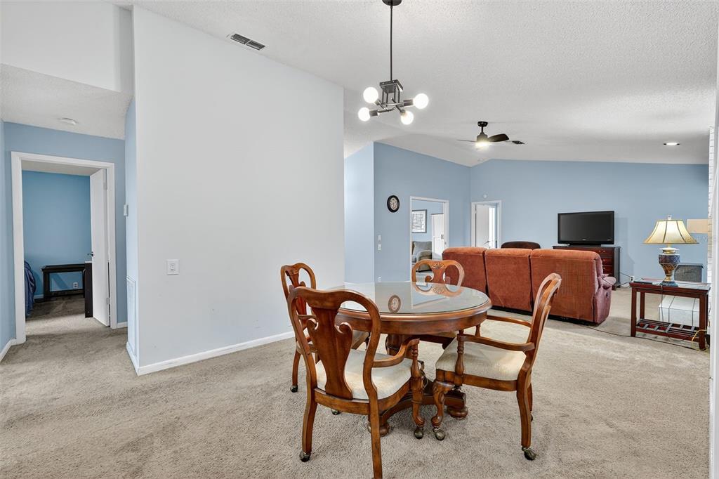 3602 Player Drive New Port Richey, FL 34655 - Photo 20 of 42 a view of a dining room with furniture