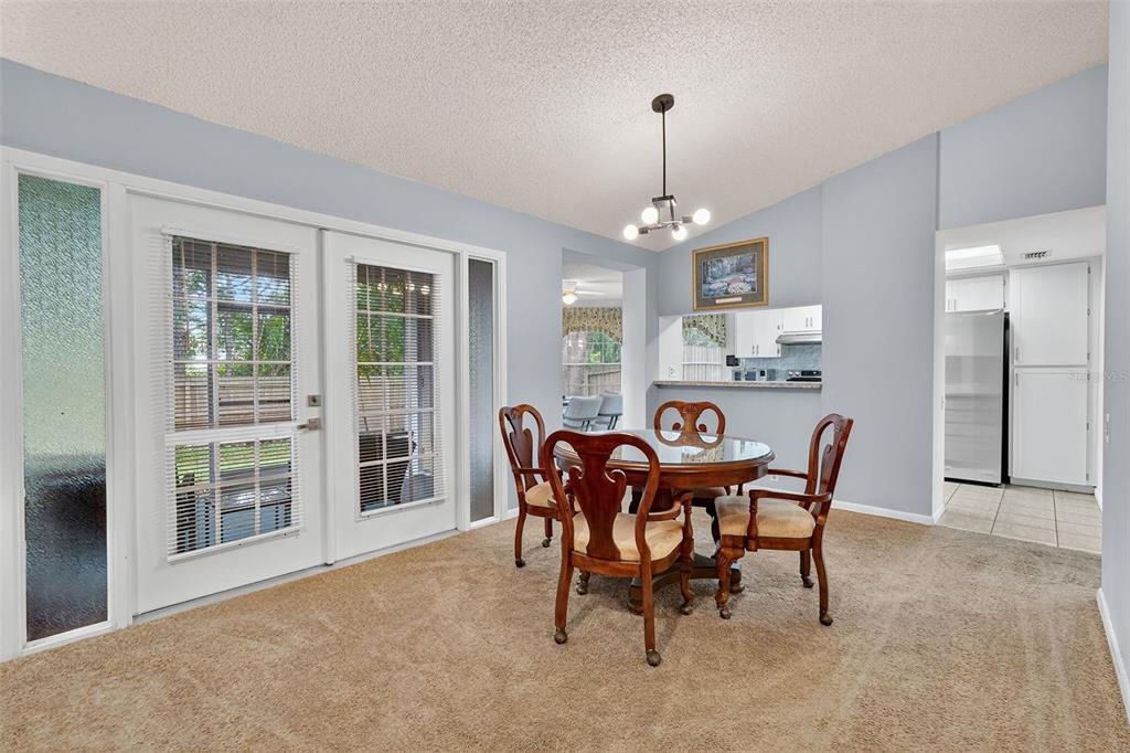 3602 Player Drive New Port Richey, FL 34655 - Photo 21 of 42 a view of a dining room with furniture window and outside view