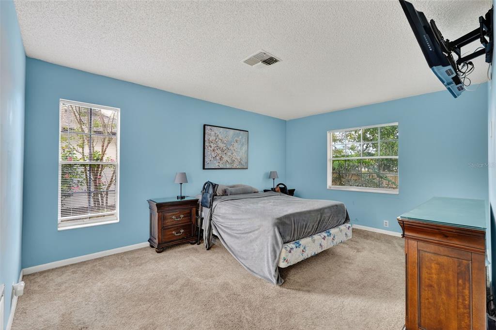 3602 Player Drive New Port Richey, FL 34655 - Photo 23 of 42 a spacious bedroom with a bed and a window