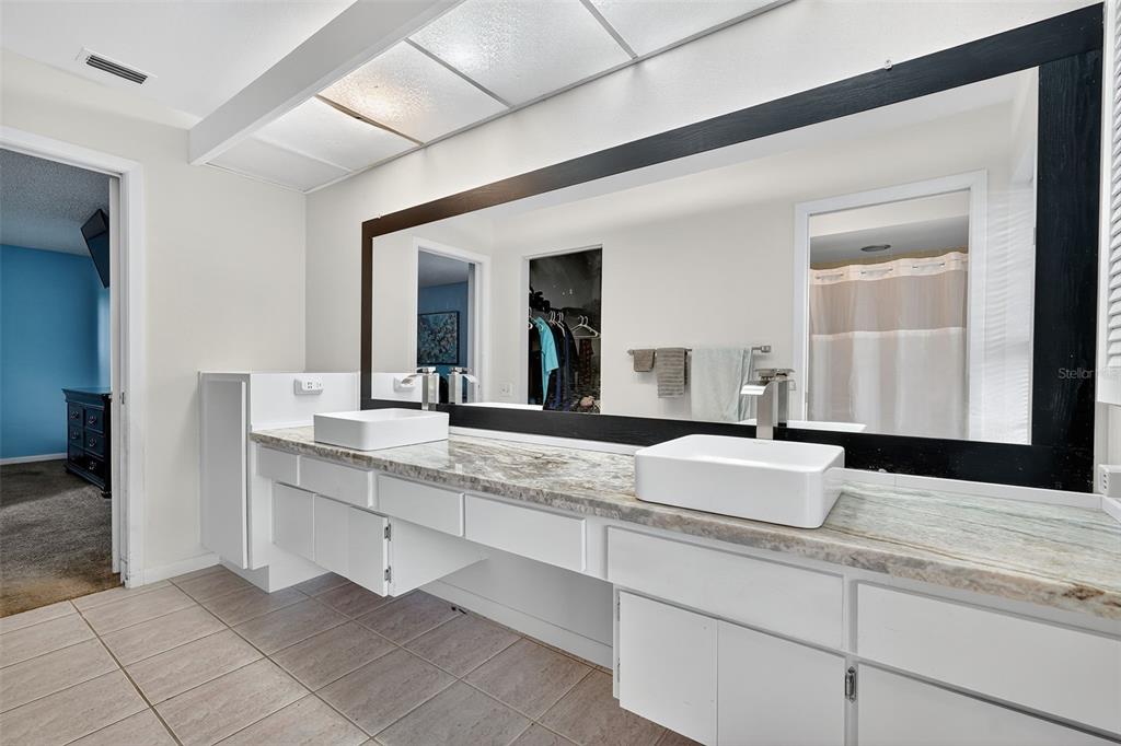 3602 Player Drive New Port Richey, FL 34655 - Photo 26 of 42 a bathroom with a sink and a mirror