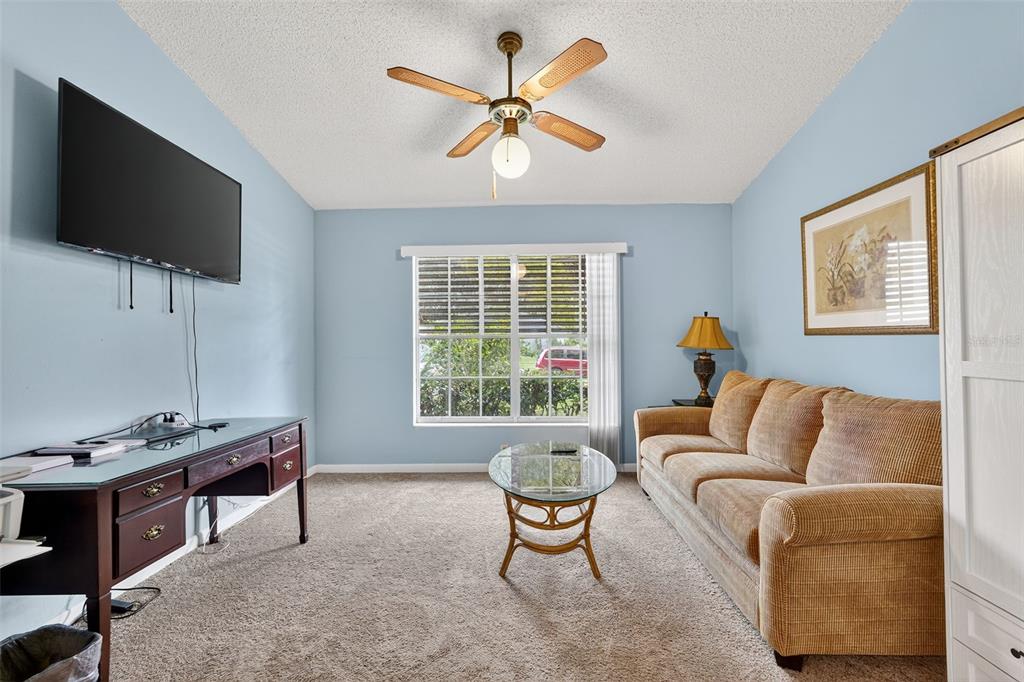 3602 Player Drive New Port Richey, FL 34655 - Photo 30 of 42 a living room with furniture and a flat screen tv