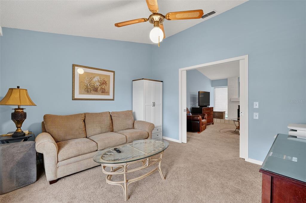 3602 Player Drive New Port Richey, FL 34655 - Photo 31 of 42 a living room with furniture and a chandelier