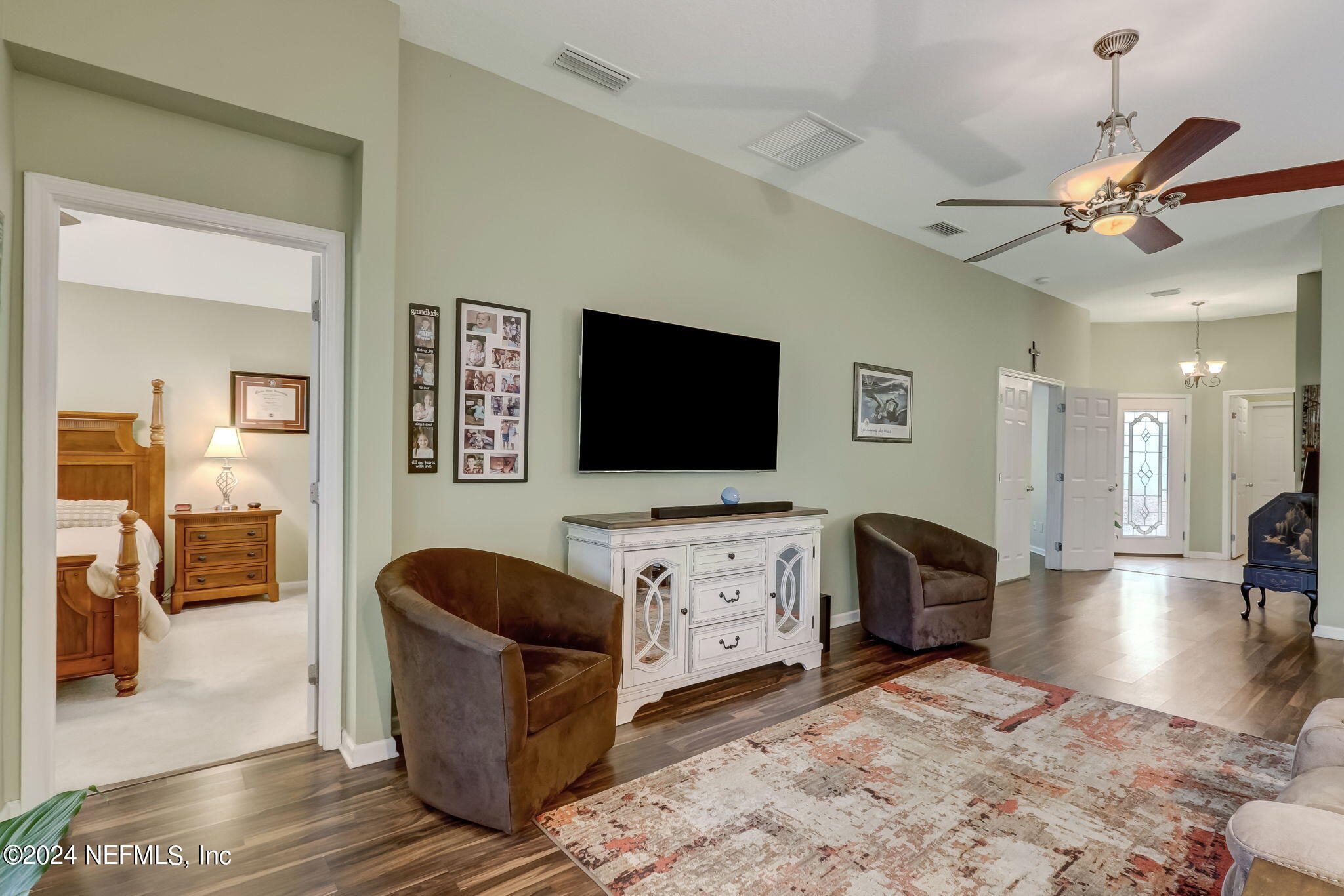 11230 Water Spring Circle Jacksonville, FL 32256 - Photo 11 of 91 a living room with furniture and a flat screen tv