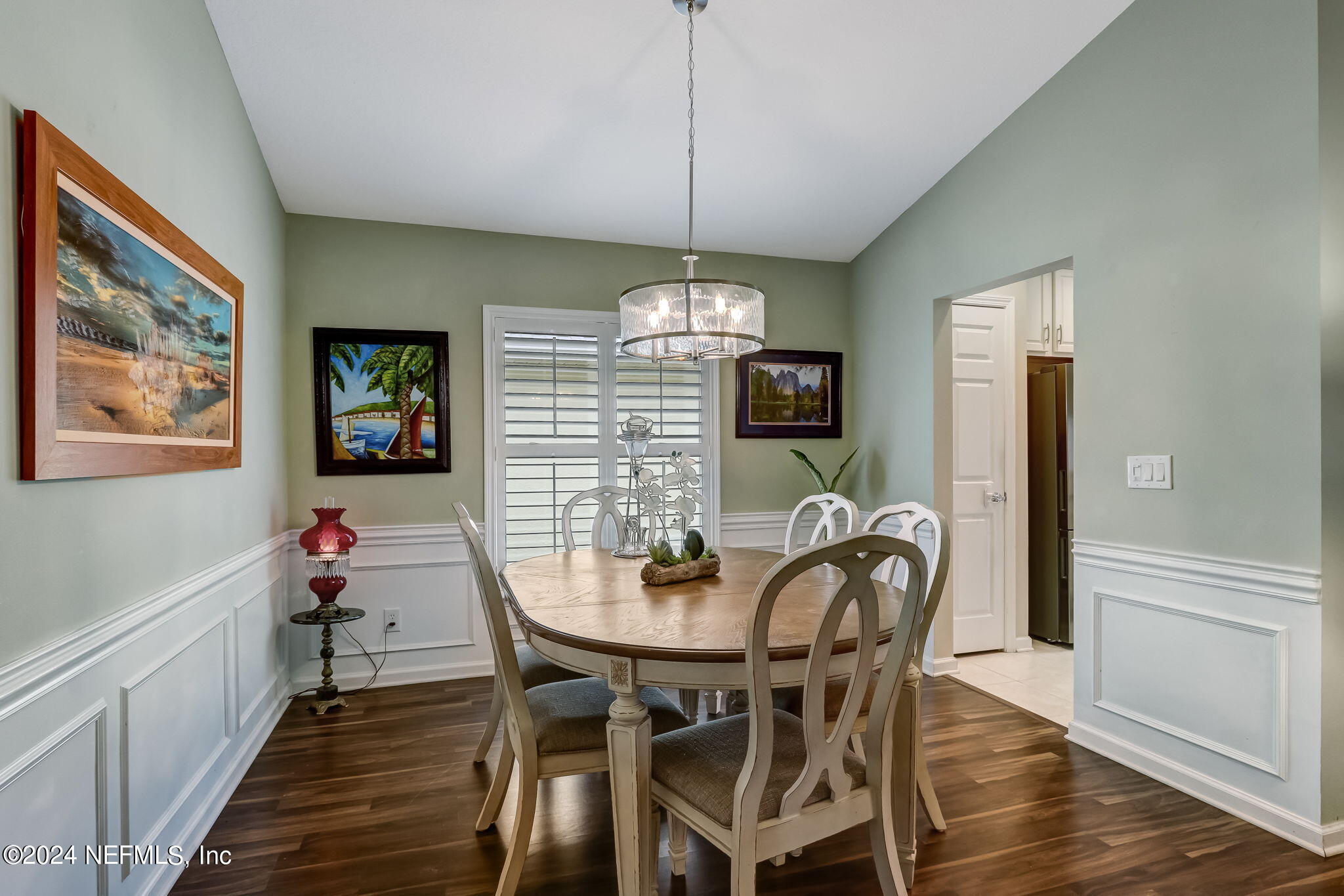 11230 Water Spring Circle Jacksonville, FL 32256 - Photo 14 of 91 a view of a dining room with furniture wooden floor and chandelier