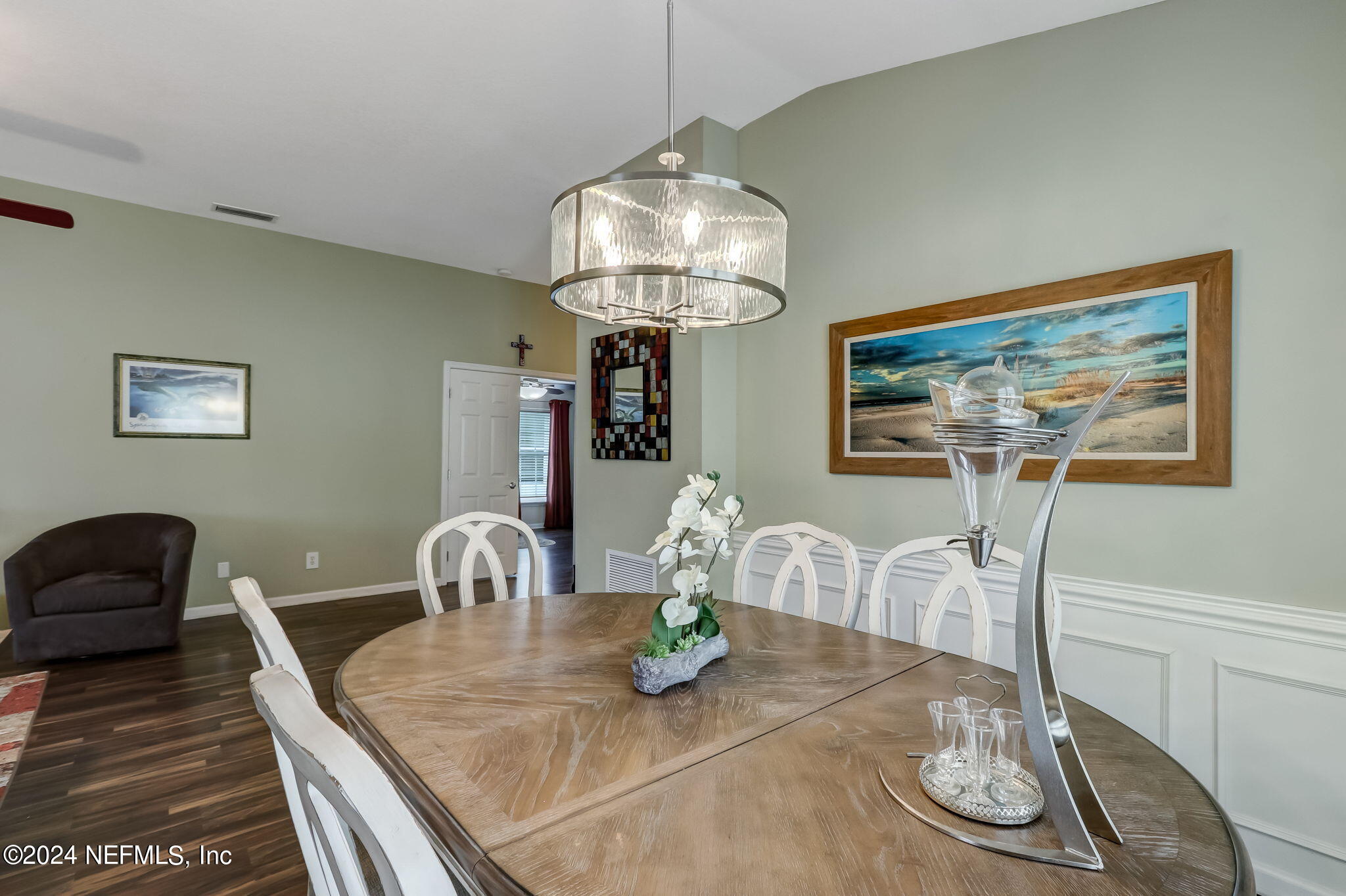 11230 Water Spring Circle Jacksonville, FL 32256 - Photo 16 of 91 a view of a dining room with furniture a chandelier and wooden floor