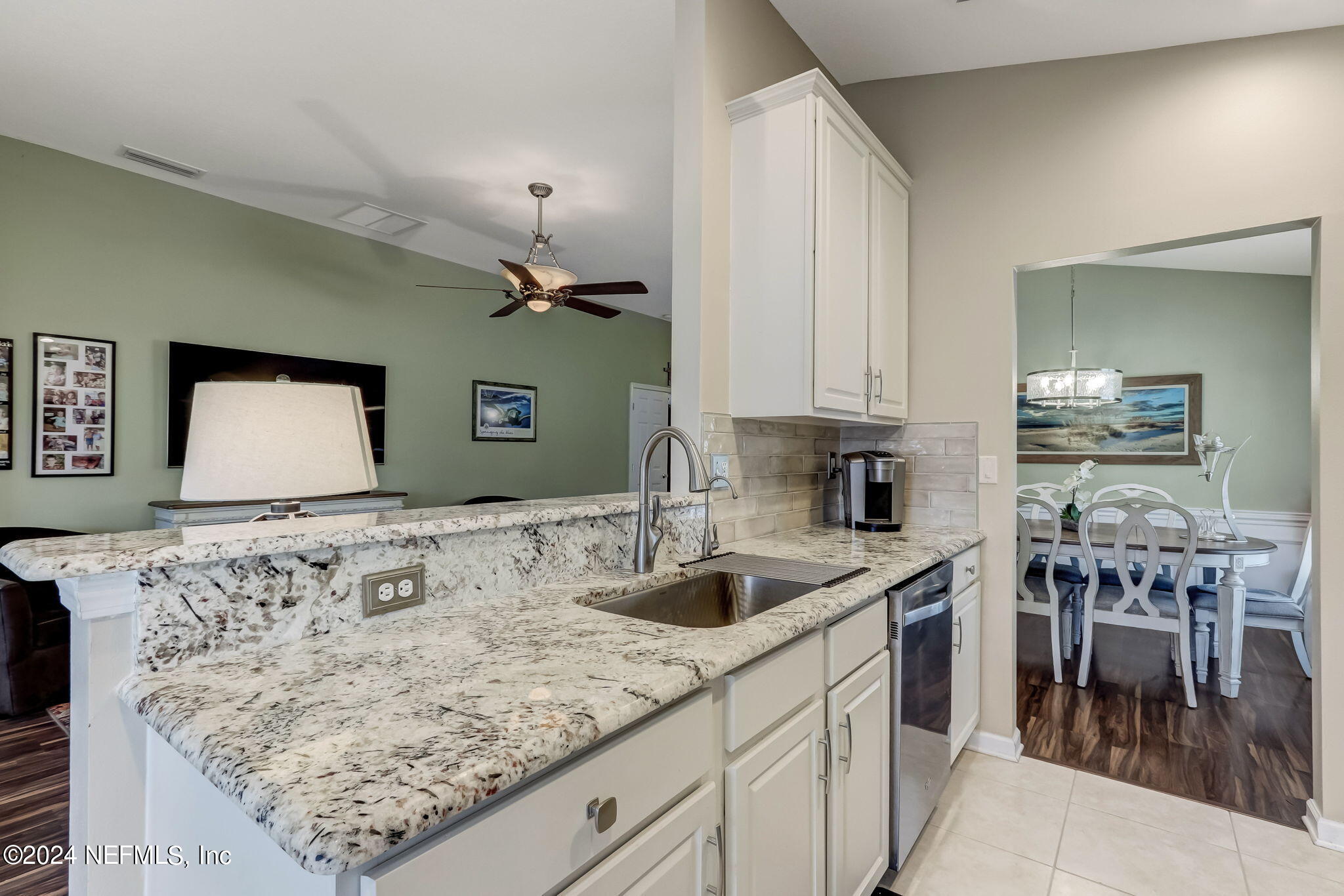 11230 Water Spring Circle Jacksonville, FL 32256 - Photo 18 of 91 a kitchen with stainless steel appliances granite countertop a sink and a refrigerator