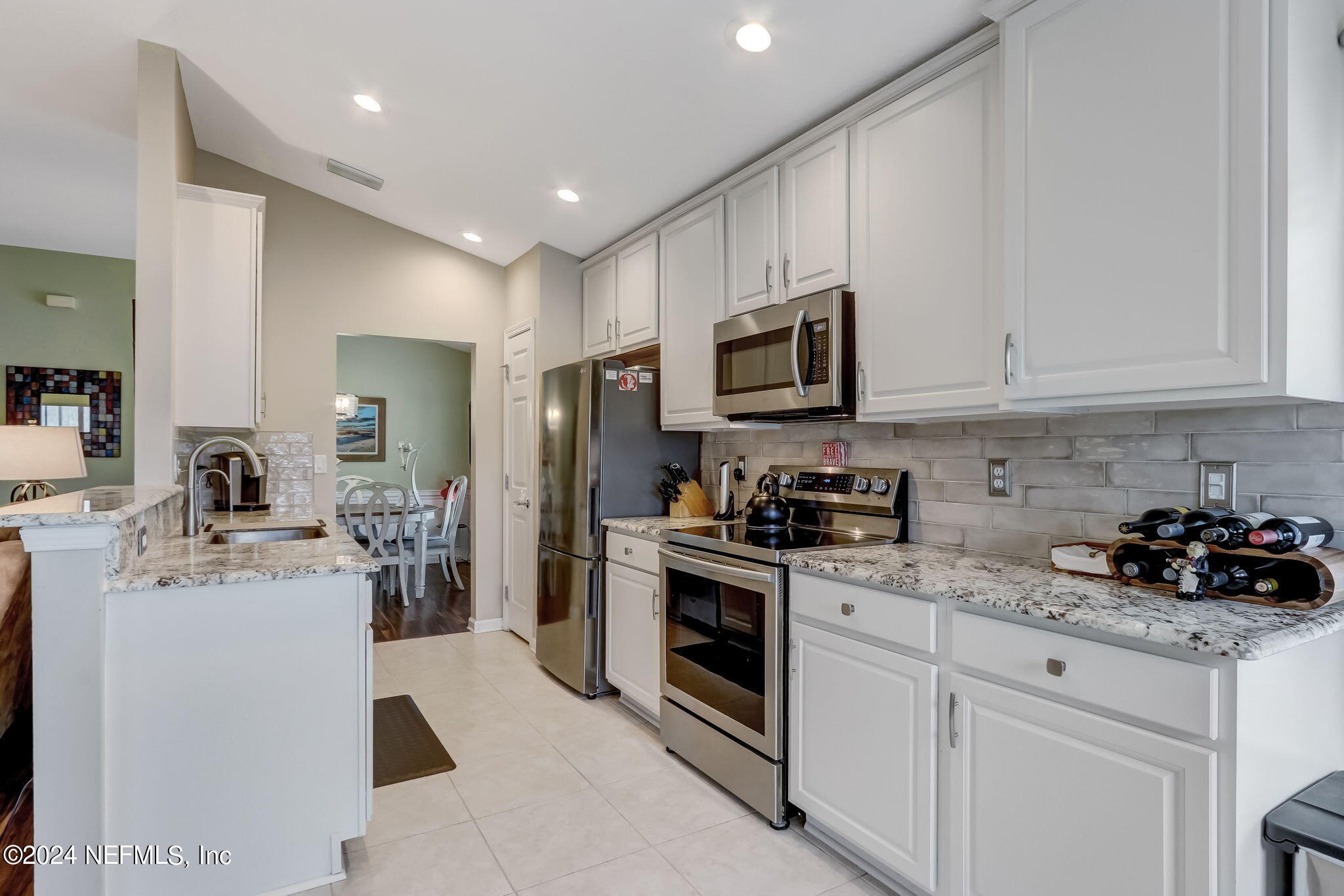 11230 Water Spring Circle Jacksonville, FL 32256 - Photo 19 of 91 a kitchen with a sink stove and refrigerator