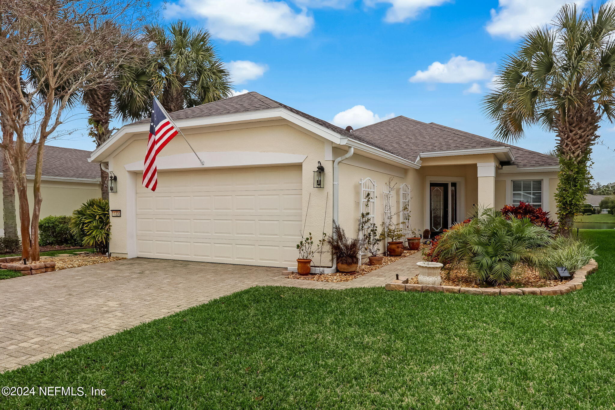11230 Water Spring Circle Jacksonville, FL 32256 - Photo 2 of 91 a front view of house with yard and outdoor seating
