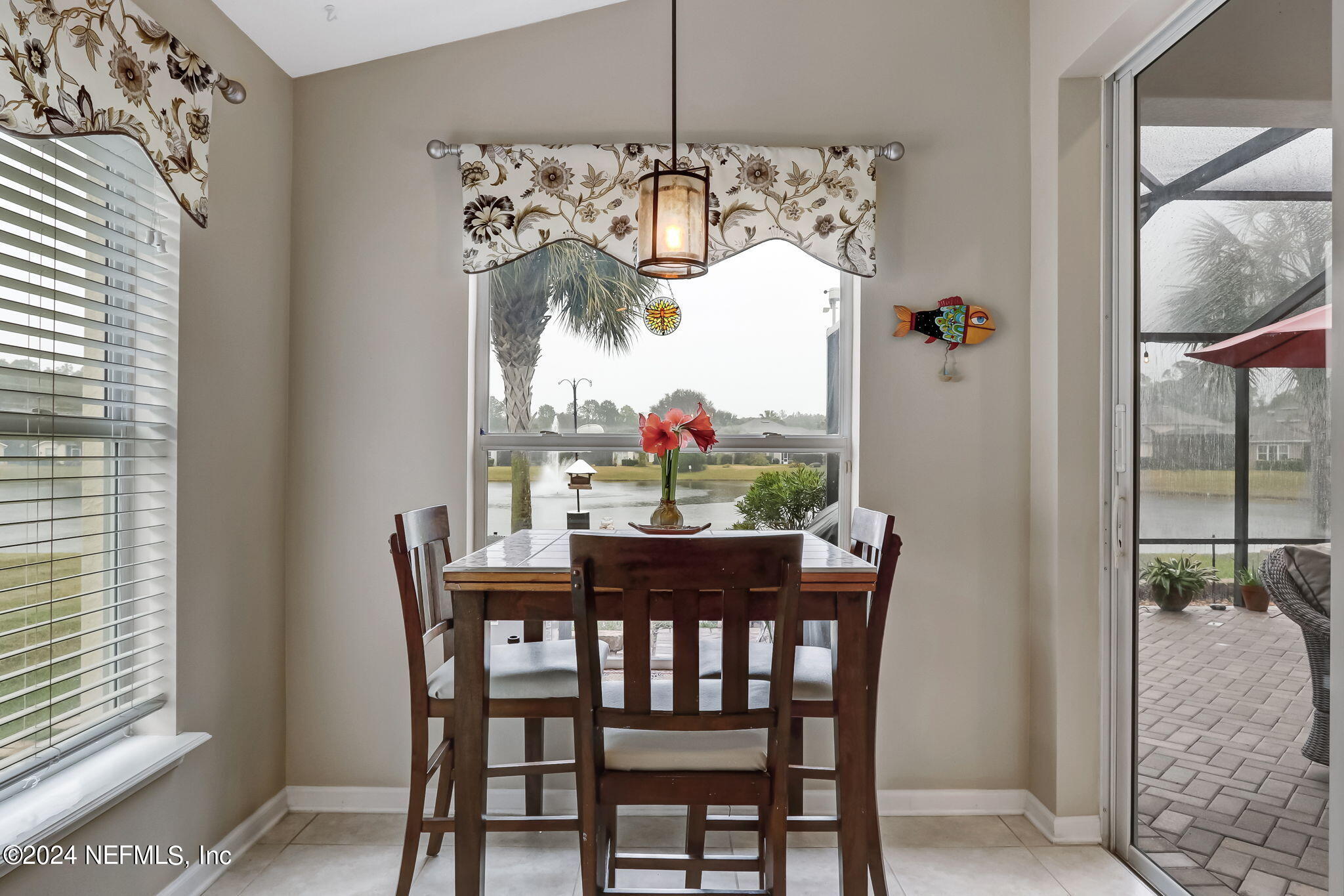 11230 Water Spring Circle Jacksonville, FL 32256 - Photo 23 of 91 a view of a dining room with furniture window and outside view